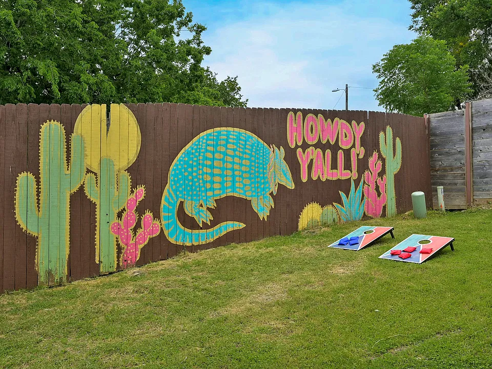 Quentissential Austin with an original retro mural which is restored from it's original time when Austin Greenhaus was actually known as the "Flamingo House"