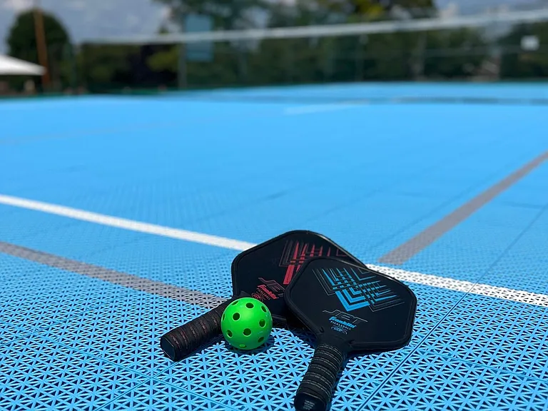 Pickleball paddles are available for resident use.