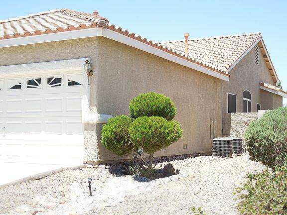 side of Garage & 2 Air Conditioners