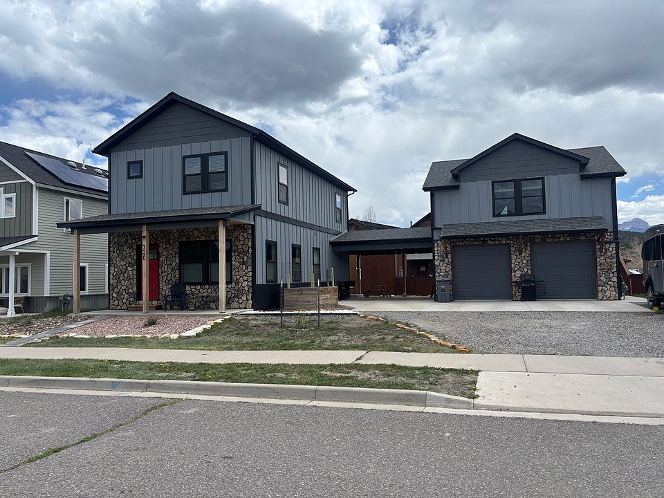Main house is on the left. Carport in the middle with access to the left side of the garage