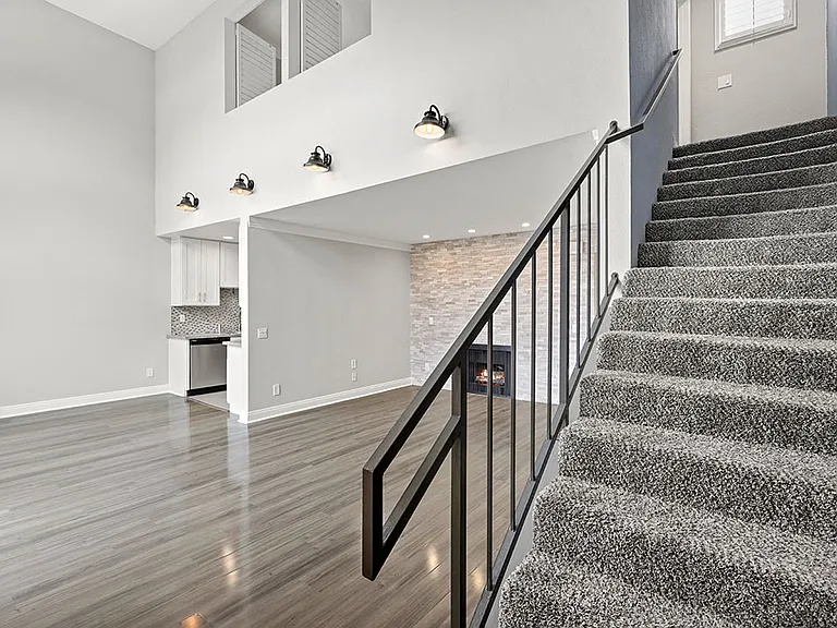 View of private stairs up to overhead loft.