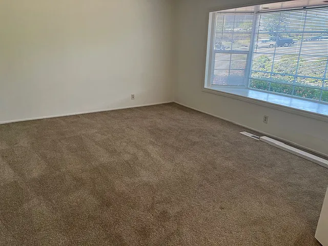 Livingroom, could be used as another large bedroom. Double doors are installed. Just needs some type of closet