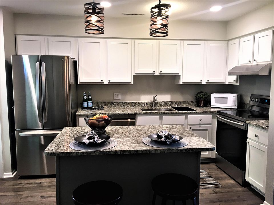 newly remodeled kitchen, granite countertops, new appliances, new cupboards.