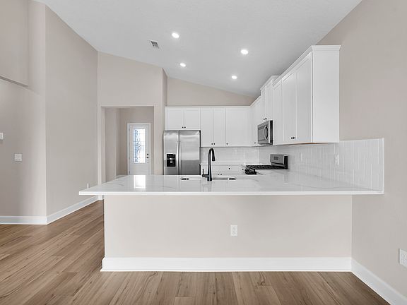 With a spacious kitchen island, casual dining and entertaining are both easy and enjoyable.