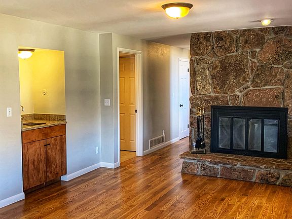 Downstairs wet bar and wood burning fireplace.