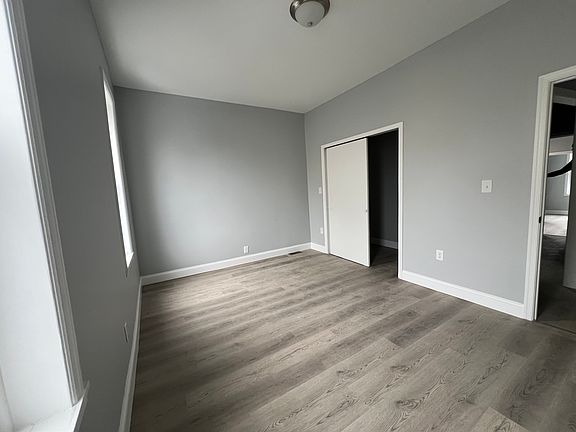 Main bedroom with walk in closet and lots of natural light.