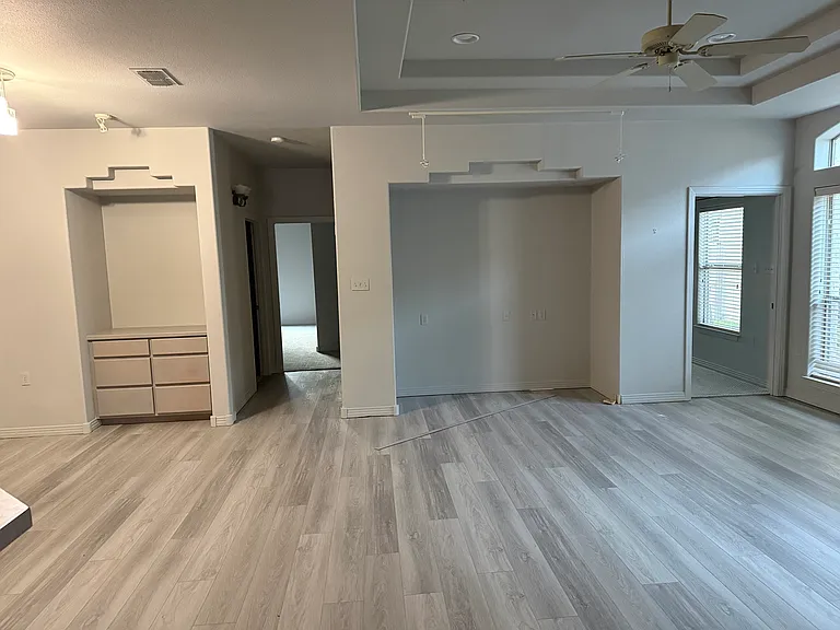VIEW OF DINING AND LIVING AREA.
The nitch is for a credenza with large flat screen tv.