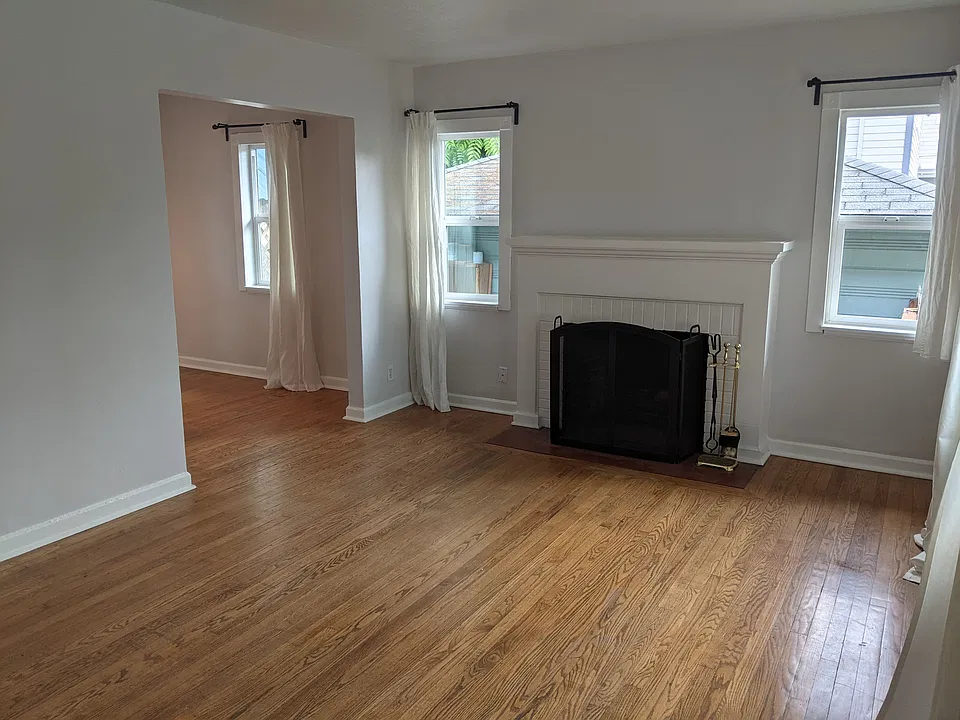 Bright, southern-facing living room with hardwood floors