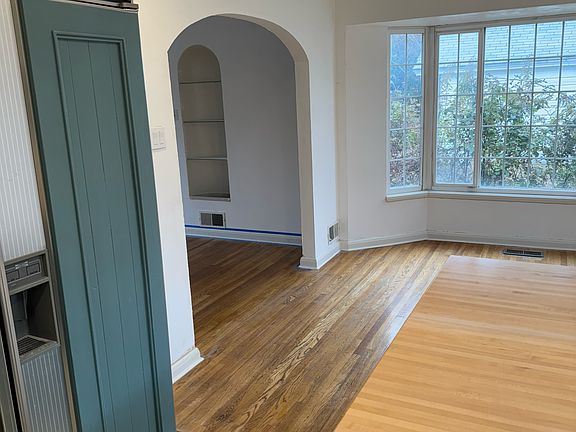 View of dining area off of the kitchen and into the living room.