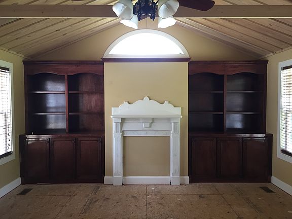 Large den with wood ceiling
