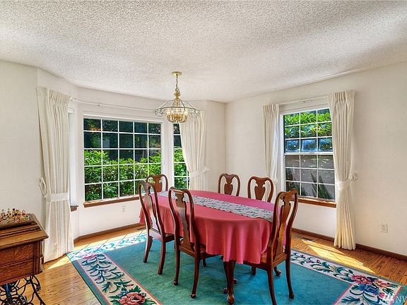 Formal dining room with room for a very large table + buffet table- room for everyone. 