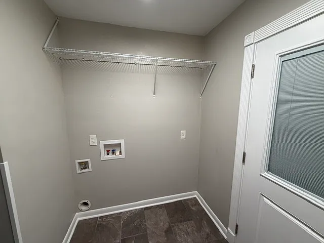 laundry room capable of accomodating a stackable unit or side-by-side washer & dryer; gas & electric hook ups