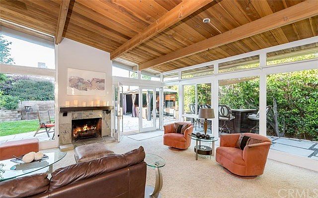 Vaulted ceilings and walls of glass create an indoor/outdoor feel that is spacious and bright