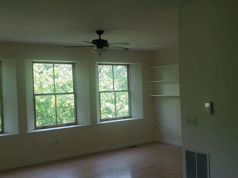 Living room with shelves.
