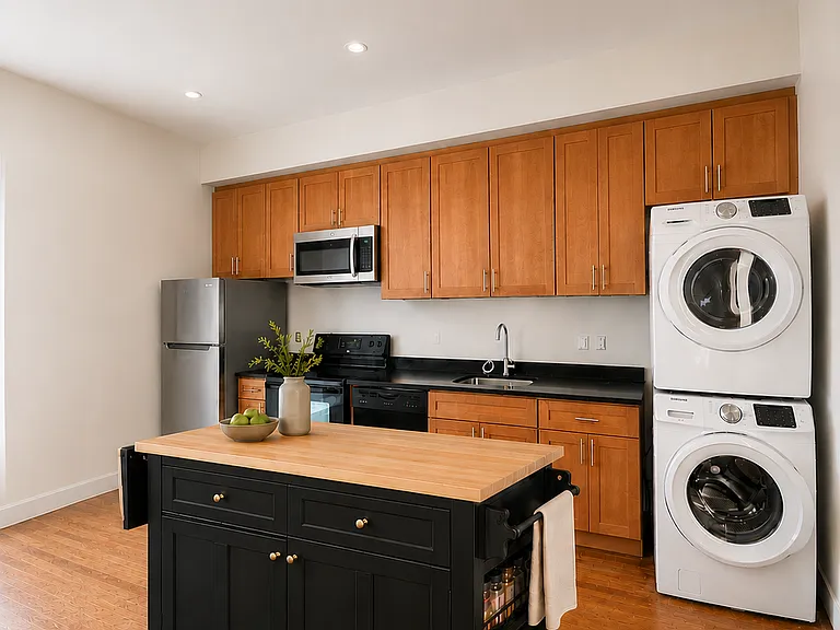 Kitchen featuring an in-unit full-size washer and dryer.