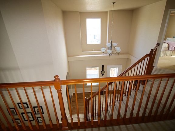 Upstairs landing looking down unto foyer