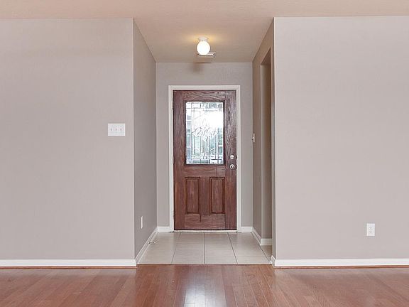 Tile entryway and a leaded glass front door!