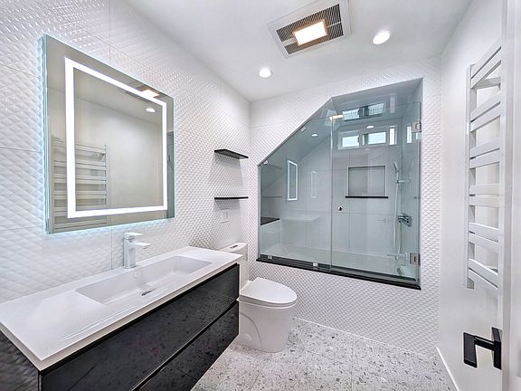 designers bathroom with spa-bath and rain shower