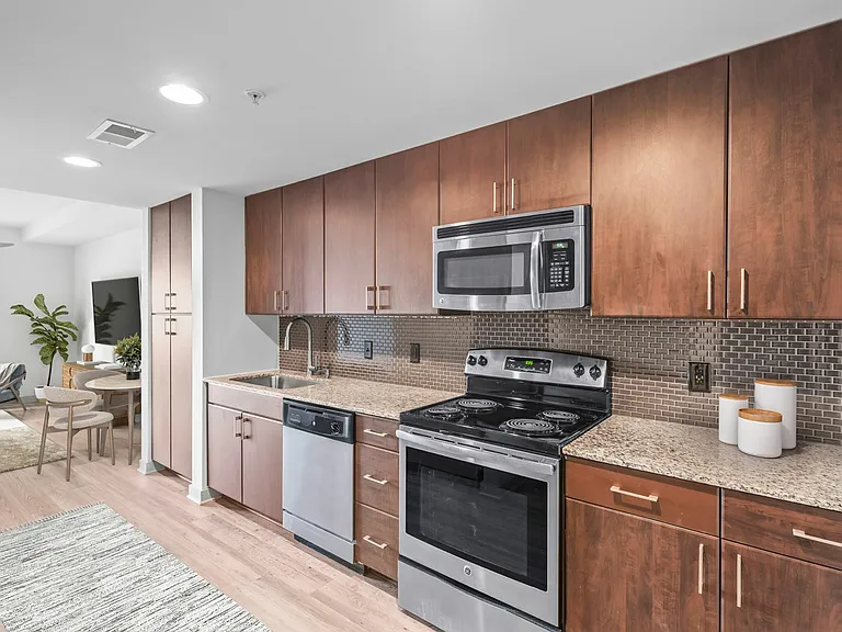 Experience the elegance of modern living with this stylish kitchen and dining setup at Cottonwood Westside Apartment in West Midtown Atlanta Experience the elegance of modern living with this stylish kitchen and dining setup at Cottonwood Westside Apartme