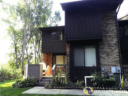 END UNIT CONDO OFFERS PRIVACY & VIEW OF GOLF COURSE AND WOODS