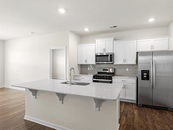 large island and a beautiful new kitchen