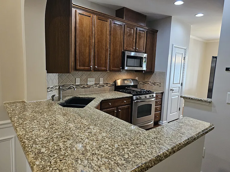 Kitchen with Granite and Tile Backsplash