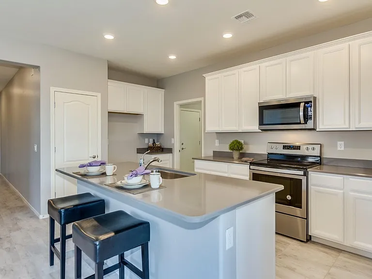 Beautiful Quartz Counters, Island with breakfast bar, stainless steel appliances (stainless steel refrigerator is in kitchen, but not pictured here)