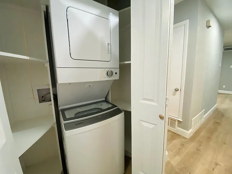 Brand new stackable washer and dryer set.