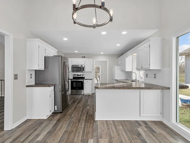 Standing at deck door looking toward kitchen and laundry room