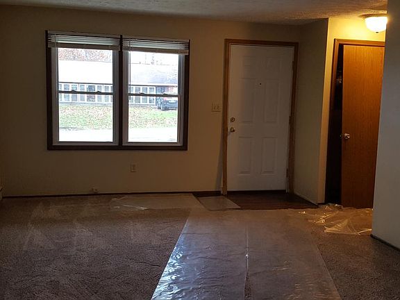 Living room with new carpet & entrance closet