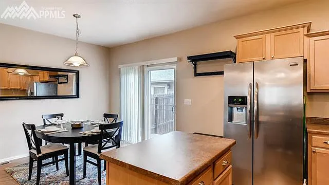 sliding door goes to a breeze way to the garage