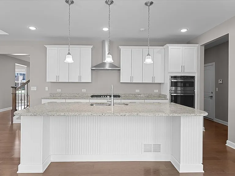 Stunning kitchen with stainless steel appliances, granite counters, and open concept