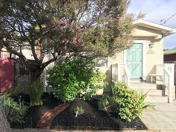 Built in benches on your front porch overlook garden.