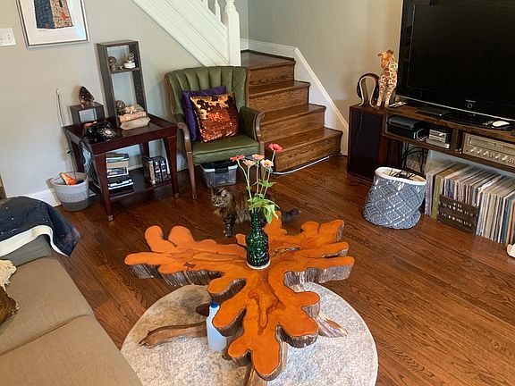 Living room, as you walk in, with all natural wood floors