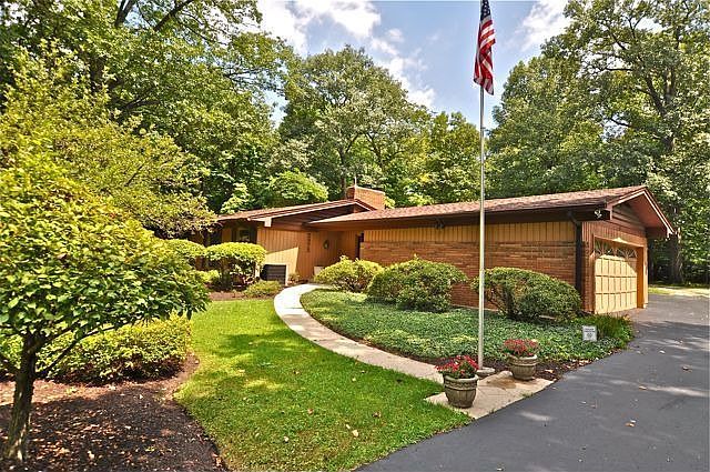 Home on over two acres adjacent Ft. Harrison State Park