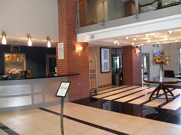 Front desk staff and gated lobby