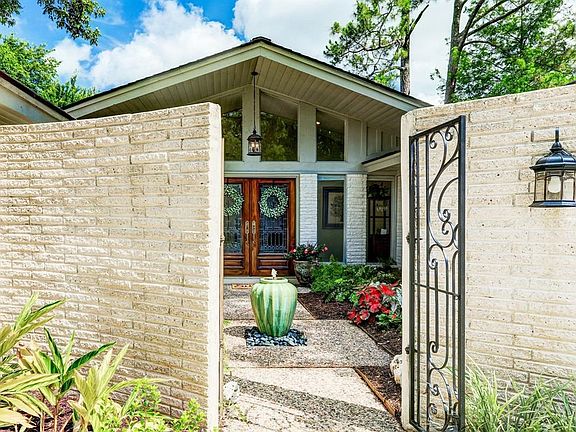The private courtyard is a showstopper with the leaded glass doors and tranquil fountain.