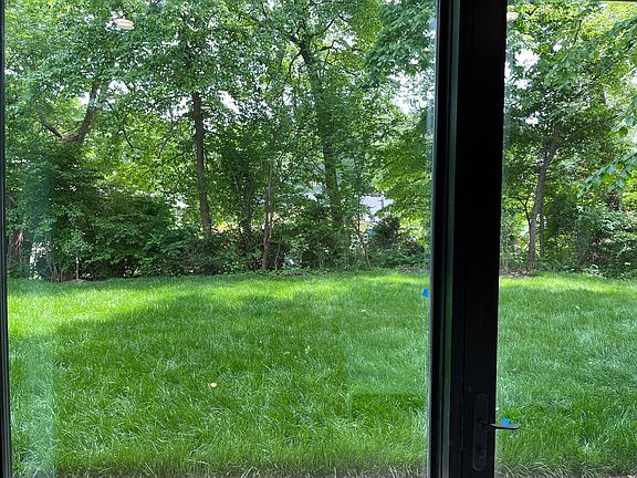 8 ft windows. looking outside to the backyard.