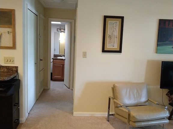 Hallway leading to bathroom and bedroom.