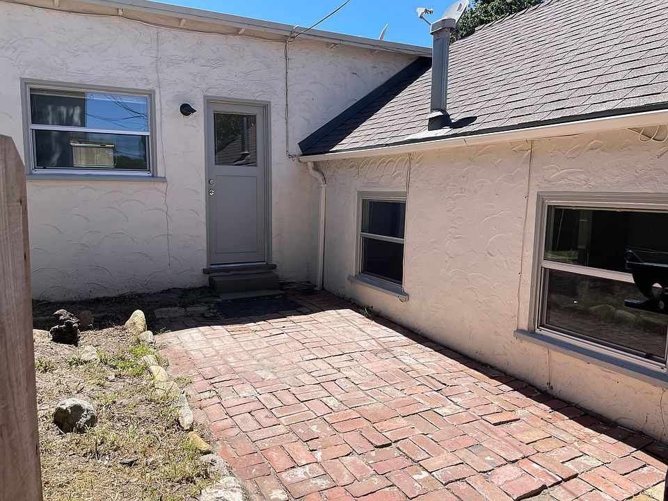 Entry to kitchen from private, fenced courtyard