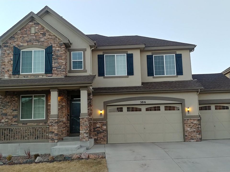 Stucco and stone exterior. 3 car garage