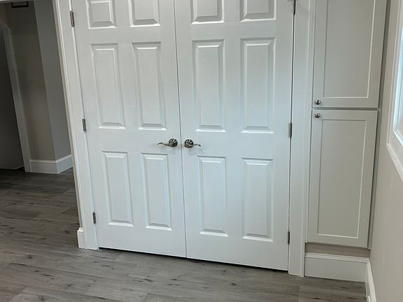 Double door pantry in eat-in kitchen