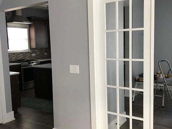 Looking into kitchen/French doors to dining room