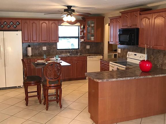 Open Kitchen featuring island and peninsula countertop for lots of countertop seating