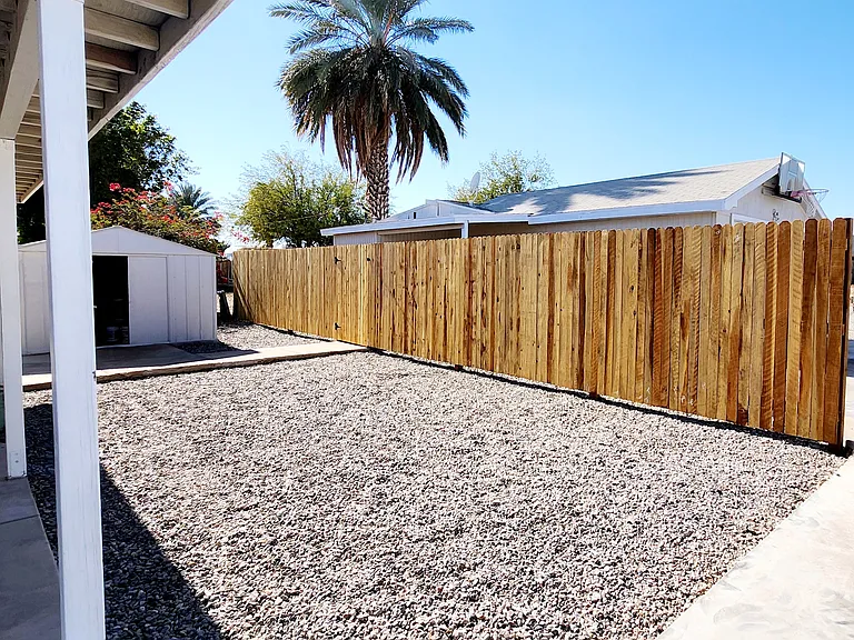 Backyard with private fence & shed for storage