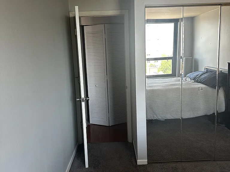 Bedroom facing closet and bedroom entrance