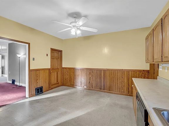 large eat-in kitchen, entrance to basement.
