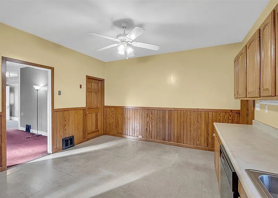 large eat-in kitchen, entrance to basement.