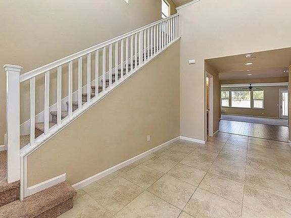 entry way (stairway is now laminated, not carpet)