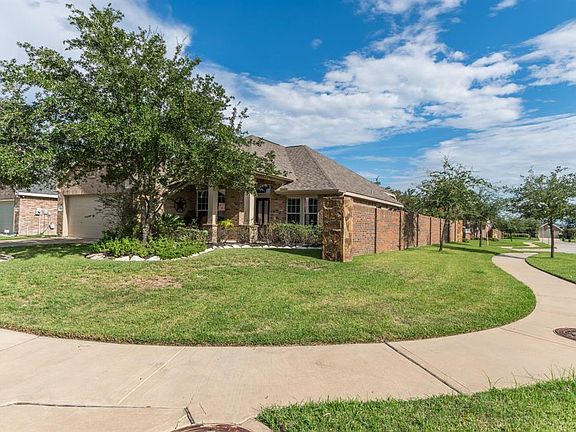 Situated on a large corner lot with brick fencing.